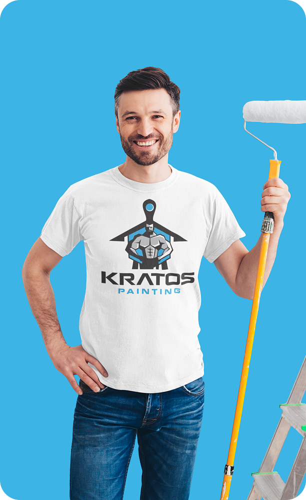 Kratos Painting painter wearing a branded shirt and holding a paint brush on-site