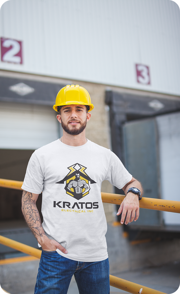 Kratos electrician standing in front of a warehouse, ready for professional electrical service