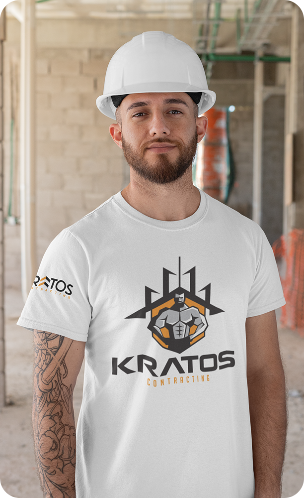 A skilled Kratos Contracting worker in safety gear and a hard hat performing site renovations and construction tasks.