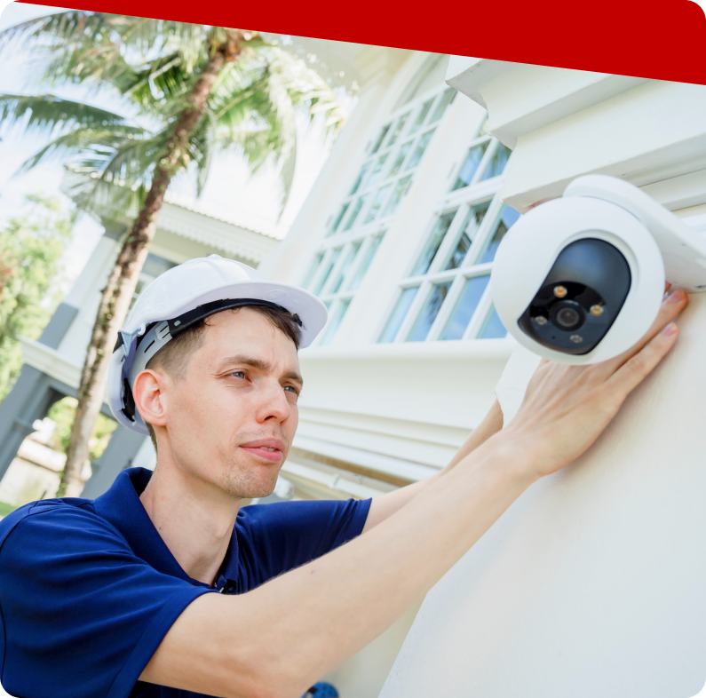 Kratos Security technician setting up security cameras on-site