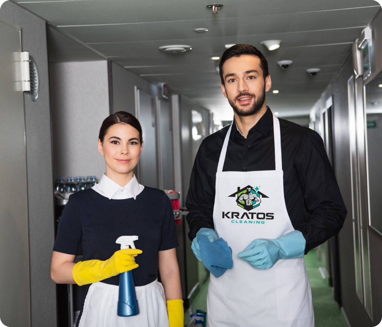 Two Kratos Cleaning professionals standing in an office, ready to provide commercial cleaning services