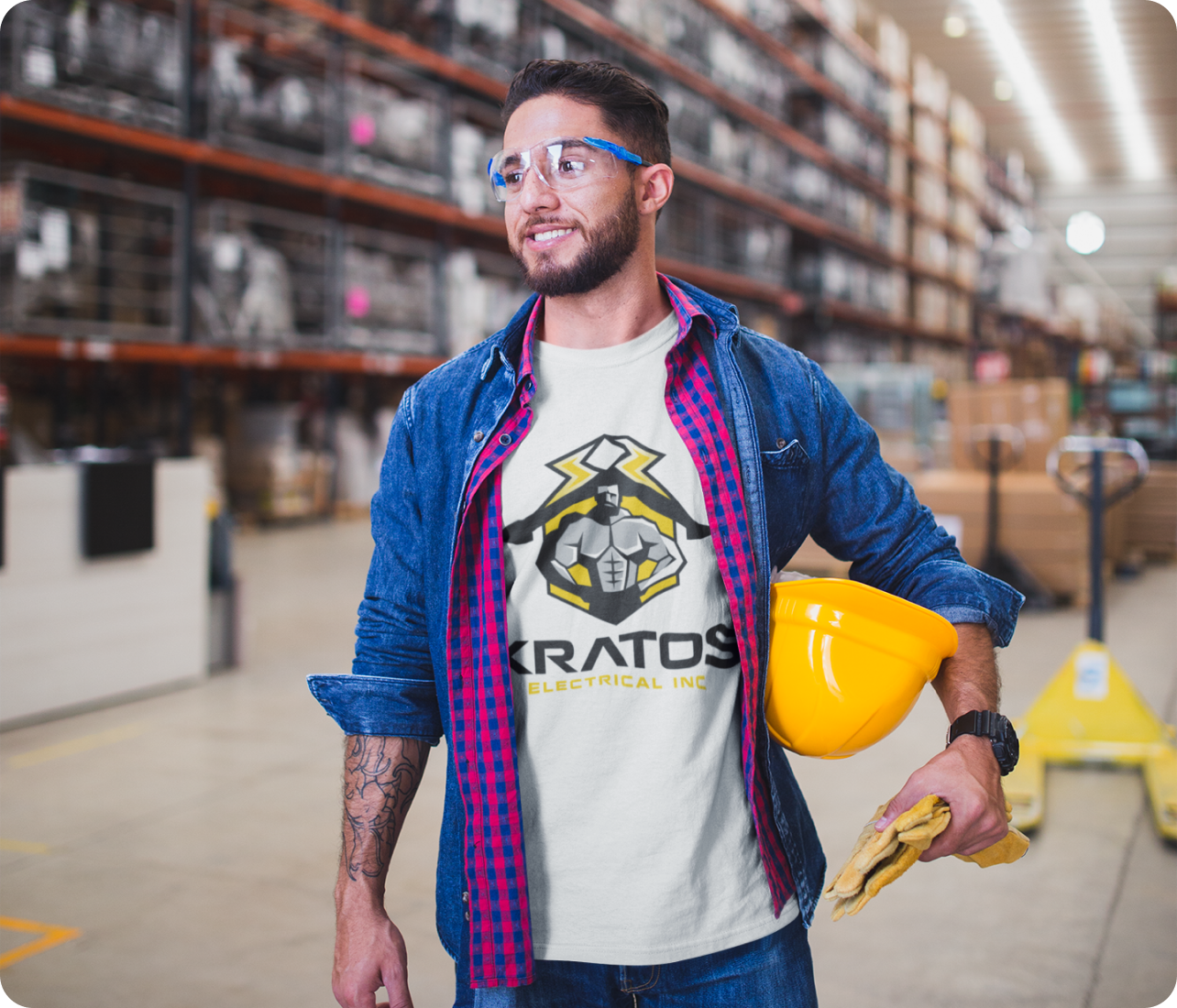 A professional Kratos Electrical contractor in a branded uniform and safety gear working on a residential electrical panel.